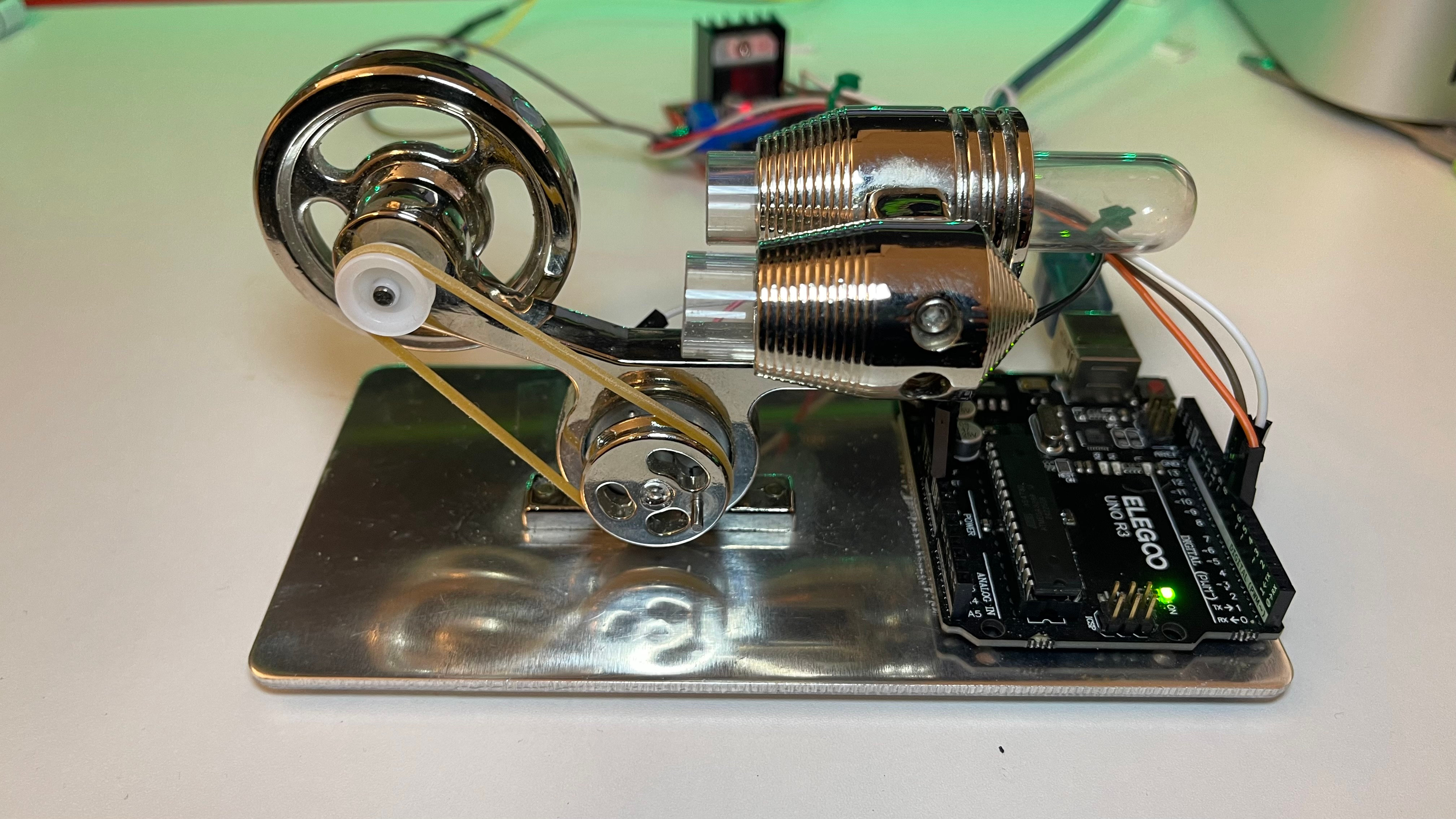 Side view of the rig showing the Elegoo Uno R3 next to the polished aluminium base of the Stirling chassis